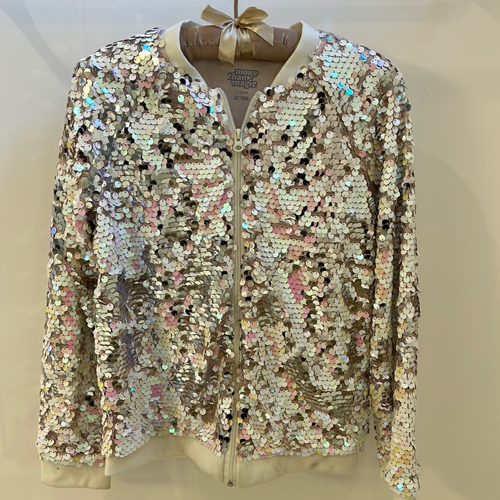 Perfect for the HOLIDAYS! This has sequins and size 14/16. Zips/light weight.
